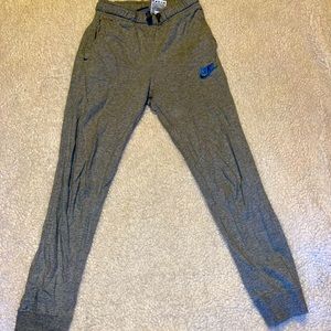NIKE gray joggers with blue logo